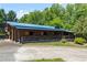 The property has a large barn and outbuildings at 200 Mcclure Dr, Cumming, GA 30028