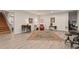 A finished basement provides additional living space with light vinyl flooring and neutral paint at 200 Mcclure Dr, Cumming, GA 30028