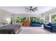 Bright, airy bedroom features lots of natural light, a ceiling fan, and hardwood flooring at 200 Mcclure Dr, Cumming, GA 30028