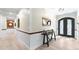 Inviting entryway with decorative front doors, beautiful flooring, and paneled wainscoting at 200 Mcclure Dr, Cumming, GA 30028