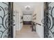 Inviting foyer with hardwood floors, wainscoting, and an elegant chandelier, creating a warm and welcoming entrance at 200 Mcclure Dr, Cumming, GA 30028