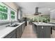 Spacious kitchen featuring stainless appliances, light countertops, and gray cabinets at 200 Mcclure Dr, Cumming, GA 30028