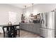 This kitchenette features stainless steel appliances, granite countertops and a breakfast bar at 200 Mcclure Dr, Cumming, GA 30028