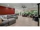 Spacious living room featuring hardwood floors, a cozy fireplace, and ample natural light from large windows at 200 Mcclure Dr, Cumming, GA 30028