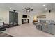 Spacious living room with wood-burning stove, ceiling fan, recessed lights, and comfortable seating at 200 Mcclure Dr, Cumming, GA 30028