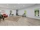 This living room area has an area rug, a red chair and a great window view at 200 Mcclure Dr, Cumming, GA 30028