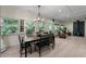 Open-concept living and dining area with natural light, wood-burning stove, and comfortable seating at 200 Mcclure Dr, Cumming, GA 30028