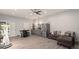 The large living area has a kitchenette and plush sectional couch for relaxing at 200 Mcclure Dr, Cumming, GA 30028