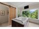 A luxurious soaking tub is the focal point of this spa-like main bathroom at 200 Mcclure Dr, Cumming, GA 30028