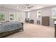 This primary bedroom has a large open floor plan and is illuminated with natural light at 200 Mcclure Dr, Cumming, GA 30028