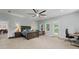 An expansive main bedroom features natural light, desk, ceiling fan and doorway to another room at 200 Mcclure Dr, Cumming, GA 30028