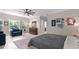 The primary bedroom features natural lighting, hardwood floors, ceiling fan and neutral walls at 200 Mcclure Dr, Cumming, GA 30028