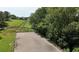 Elevated view of fenced riding arena showing beautiful, scenic setting at 200 Mcclure Dr, Cumming, GA 30028