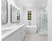 Contemporary bathroom showing double sinks, soaking tub, walk-in shower, and vanity at 208 Regester Way, Peachtree City, GA 30269