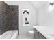 Elegant bathroom with tub, shower, hexagon tiling, and bright natural light at 208 Regester Way, Peachtree City, GA 30269