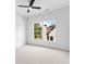 A bright, carpeted bedroom with two large windows at 208 Regester Way, Peachtree City, GA 30269