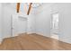 Bright bedroom showing wood floors, closet, and bathroom with double sinks and vanity at 208 Regester Way, Peachtree City, GA 30269