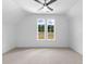 Bright bedroom with large windows, neutral walls, and plush carpeting at 208 Regester Way, Peachtree City, GA 30269