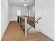Hallway with hardwood floors and a stairway at 208 Regester Way, Peachtree City, GA 30269