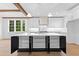 Bright kitchen featuring a center island with dark cabinets and stainless steel appliances at 208 Regester Way, Peachtree City, GA 30269