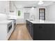 Stylish kitchen with an island, stainless steel appliances, and bright white cabinetry at 208 Regester Way, Peachtree City, GA 30269