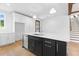 Modern kitchen boasts a large island, stainless steel appliances, and bright white cabinets at 208 Regester Way, Peachtree City, GA 30269