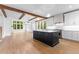 Open-concept kitchen with beamed ceilings, a center island, and lots of natural light at 208 Regester Way, Peachtree City, GA 30269
