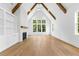 Bright living room with hardwood floors, fireplace and soaring beamed ceilings at 208 Regester Way, Peachtree City, GA 30269
