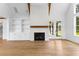 Bright living room with hardwood floors, fireplace and wood beams at 208 Regester Way, Peachtree City, GA 30269