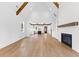 Bright living room featuring wood floors, fireplace, wood beams, and open layout at 208 Regester Way, Peachtree City, GA 30269