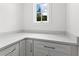 Bright pantry with white cabinets and quartz counters at 208 Regester Way, Peachtree City, GA 30269