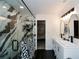 Stylish bathroom with double vanity, luxurious marble shower, and black accents, offering a spa-like experience at 354 Jada Ln, Villa Rica, GA 30180