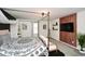 Bright bedroom featuring a canopy bed, wooden accent wall with TV, and comfortable seating area at 354 Jada Ln, Villa Rica, GA 30180