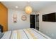 Bedroom featuring neutral walls, carpet, TV, door and a wicker pendant light at 354 Jada Ln, Villa Rica, GA 30180