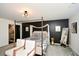 Stylish bedroom featuring a canopy bed, modern decor, and luxurious finishes for a relaxing retreat at 354 Jada Ln, Villa Rica, GA 30180