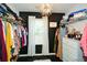 Organized walk-in closet with custom shelving, ample storage, and stylish chandelier lighting at 354 Jada Ln, Villa Rica, GA 30180
