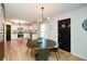 Modern dining room adjacent to the kitchen featuring a round dining table and stylish lighting at 354 Jada Ln, Villa Rica, GA 30180