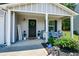 Cozy covered front porch features tasteful decor, seating, and a welcoming atmosphere at 354 Jada Ln, Villa Rica, GA 30180