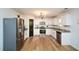 Bright kitchen featuring white cabinets, stainless steel appliances, and hardwood floors at 354 Jada Ln, Villa Rica, GA 30180