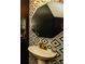 Chic powder room featuring geometric patterned tile, and a pedestal sink with gold fixtures at 354 Jada Ln, Villa Rica, GA 30180