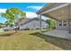 Beautiful backyard with covered patio and well-manicured lawn, great for outdoor living at 427 Bluffs View Ln, Canton, GA 30114
