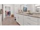 Bright bathroom featuring granite countertops, double sink, and a walk-in closet for ample storage at 427 Bluffs View Ln, Canton, GA 30114