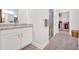 Bright bathroom featuring granite countertops, walk-in shower and a walk-in closet for ample storage at 427 Bluffs View Ln, Canton, GA 30114