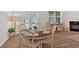 Comfortable dining area with a round table, wood floors, and direct access to the outdoor space at 427 Bluffs View Ln, Canton, GA 30114