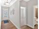 Hallway view featuring modern fixtures and an entrance into a carpeted bedroom and bathroom at 427 Bluffs View Ln, Canton, GA 30114