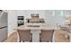Modern kitchen featuring a granite island with seating, and stainless steel appliances at 427 Bluffs View Ln, Canton, GA 30114