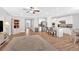 Inviting living room with wood floors, neutral decor, and an open layout leading to the kitchen at 427 Bluffs View Ln, Canton, GA 30114