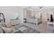 Comfortable main bedroom with ensuite area, dresser, and carpet floors at 427 Bluffs View Ln, Canton, GA 30114