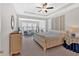 Bright main bedroom with tray ceiling, sitting area, and ample natural light at 427 Bluffs View Ln, Canton, GA 30114