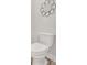 A clean and functional white toilet in a well-lit bathroom at 427 Bluffs View Ln, Canton, GA 30114
